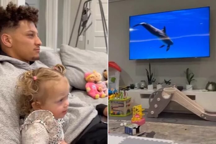 Patrick Mahomes and Daughter Sterling Cuddle Up to Watch Animal Planet Together: 'Ster Loves' It