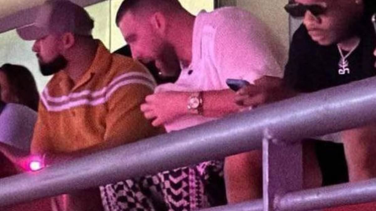 Travis Kelce takes his seat at Taylor Swift's latest Eras Tour show in Singapore after racing back to Asia following brother Jason's retirement from football earlier this week